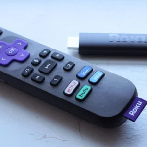 A Roku streaming stick with remote