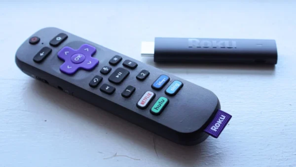 A Roku streaming stick with remote