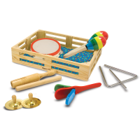 A variety of children's instruments including a tambourine, maracas, a triangle, and cymbals are inside and outside of a wooden basket.